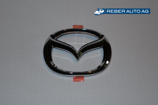 Mazda Emblem Stossfänger vorne 98-00